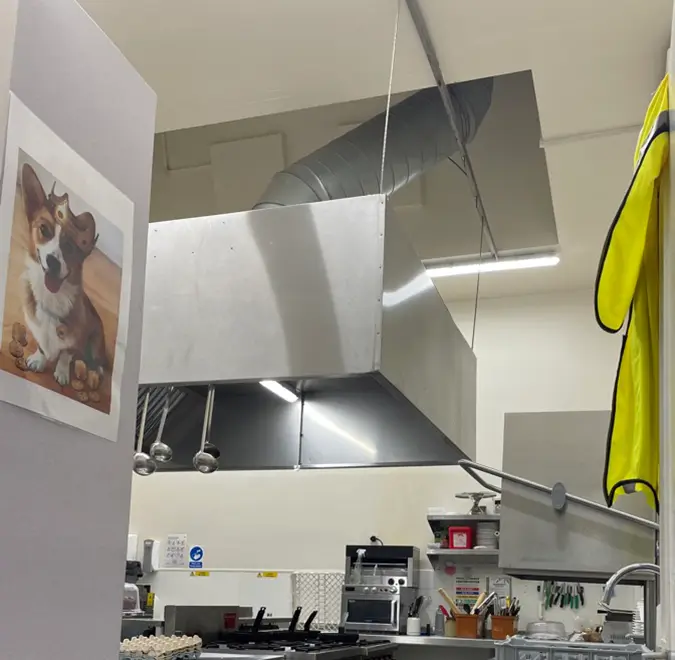 Restaurant kitchen with bright white ceiling lights