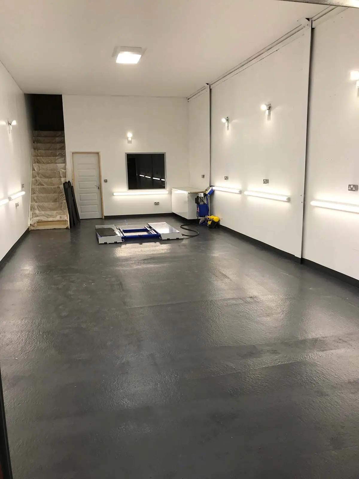 white garage interior with various spotlights