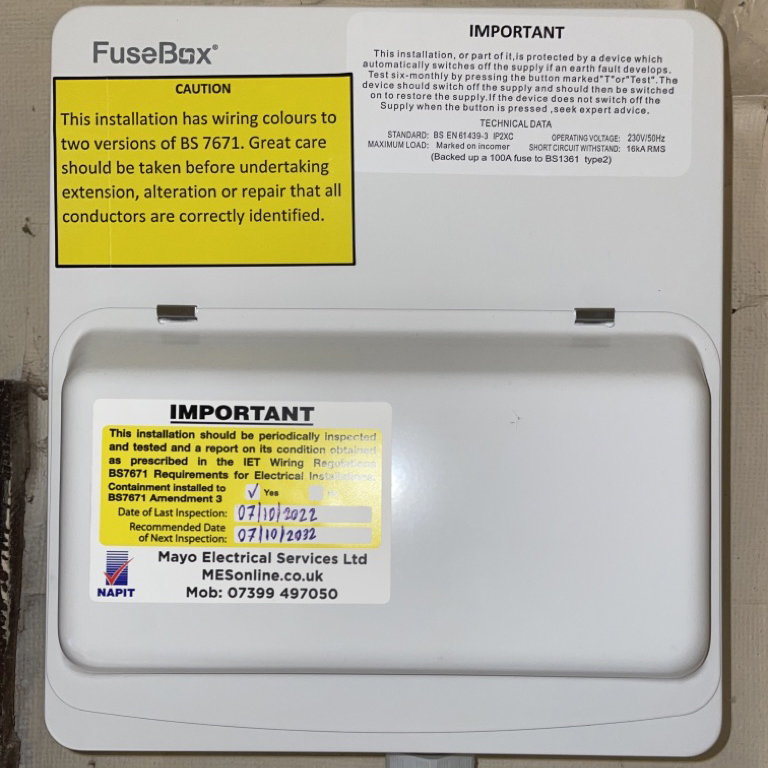 consumer unit with updated inspection stickers